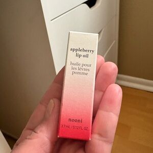 Nooni Appleberry Lip Oil and the color appleberry factory sealed.